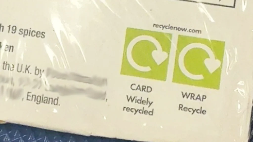 close up of packaging with recyclable logos displayed for card and wrap